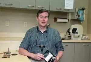 Dr. John L. Kinsley at work in the office.